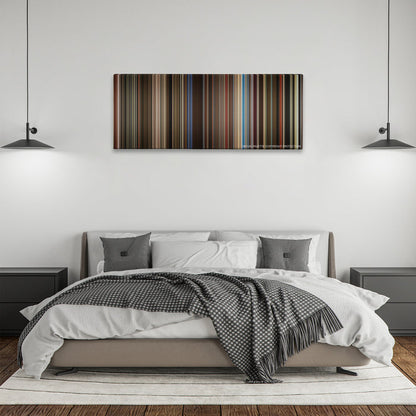Rocketman color palette canvas above a bed, between two black pendant lamps