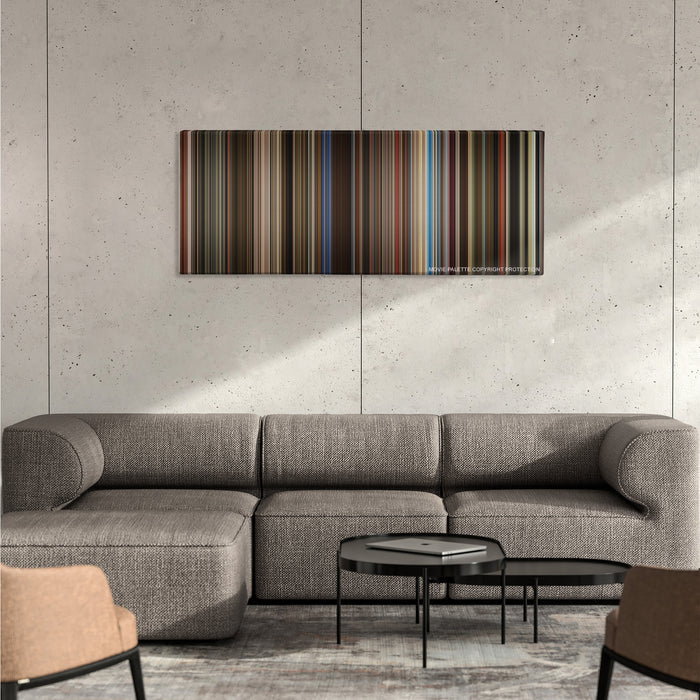 Rocketman color palette canvas on a concrete wall above a gray sectional sofa
