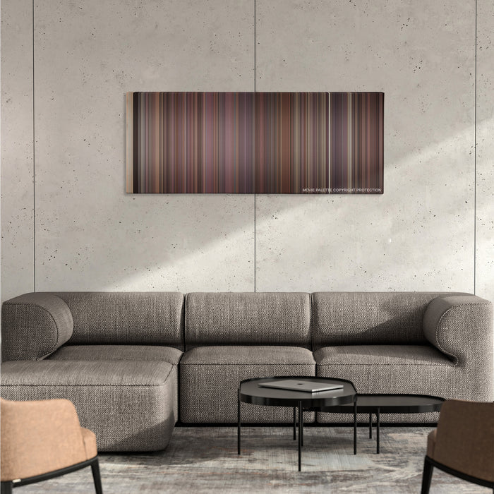 Rope color palette canvas on a concrete wall above a gray sectional sofa