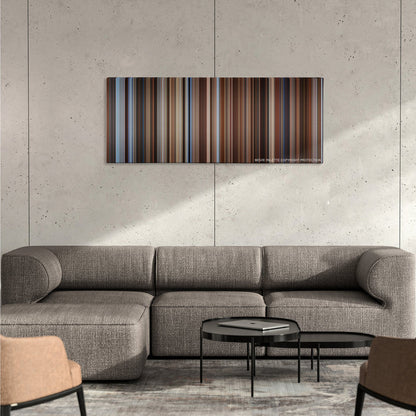 Seven Years in Tibet color palette canvas on a concrete wall above a gray sectional sofa