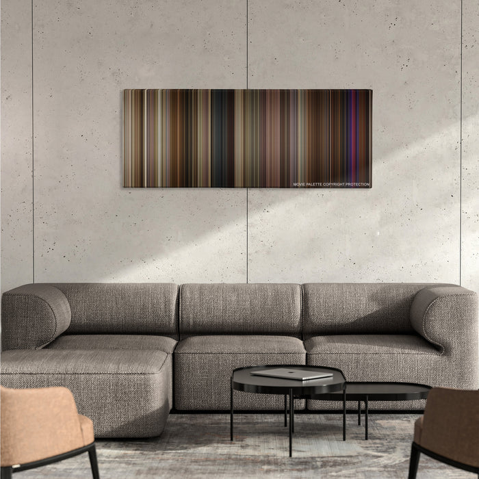 Silver Linings Playbook color palette canvas on a concrete wall above a gray sectional sofa