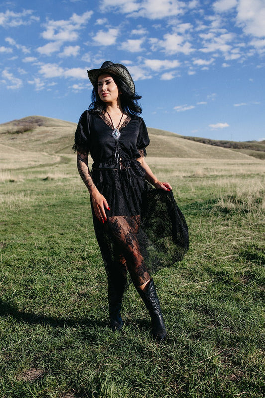 Black lace western top styled for gothic cowgirl outfits, country concert fashion, edgy western style and boho rodeo looks from Sand + Charcoal Boutique