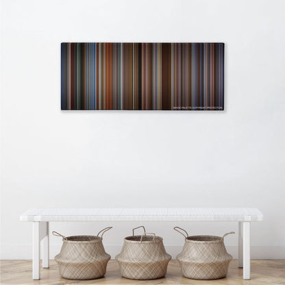 The Family Man color palette canvas above a white bench with three woven baskets