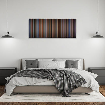 The Family Man color palette canvas above a bed, between two black pendant lamps