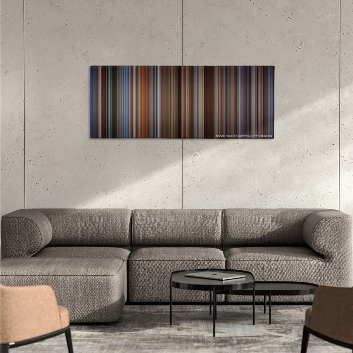 The Family Man color palette canvas on a concrete wall above a gray sectional sofa
