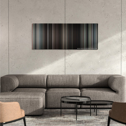 The Great Escape color palette canvas on a concrete wall above a gray sectional sofa