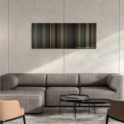 The Imitation Game color palette canvas on a concrete wall above a gray sectional sofa