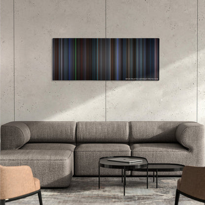 The Recruit color palette canvas on a concrete wall above a gray sectional sofa