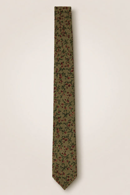 Introducing the Ivy City Co Ties in Woodland Floral—a green cotton tie adorned with a delicate pattern of small red and pink flowers and lush green leaves set against a light beige background. Perfect as a wedding accessory for nature-themed celebrations.