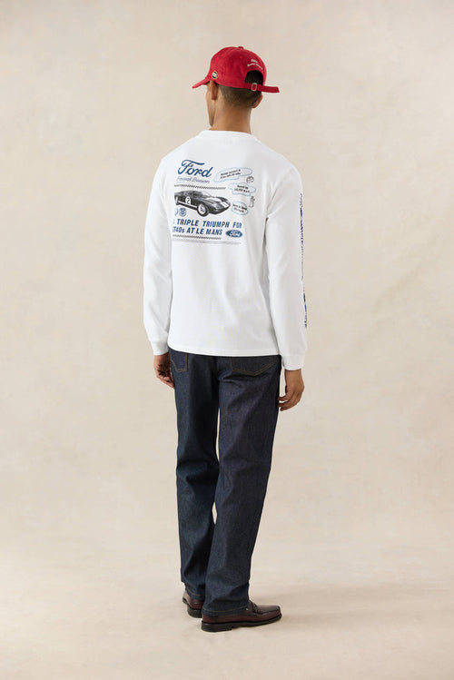 White Ford x Percival long sleeve t-shirt with a back graphic, styled with Percival raw denim heritage jeans.