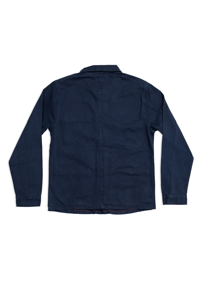 Navy blue long-sleeve shirt shown from the back, featuring a simple design with a straight hem and visible seam down the center.