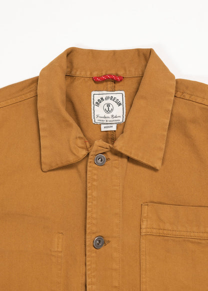 Brown button-up shirt with a collar, featuring a "Iron and Resin" label inside. A small red loop is visible near the label.