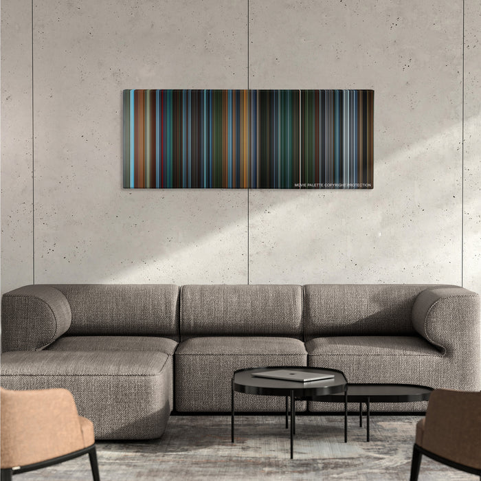 X2: X-Men United color palette canvas on a concrete wall above a gray sectional sofa
