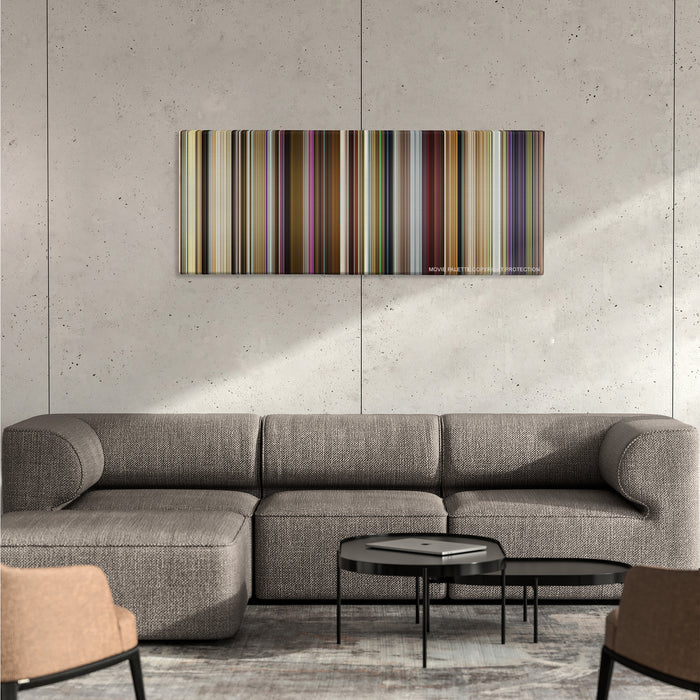 Yesterday color palette canvas on a concrete wall above a gray sectional sofa